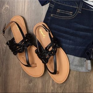Black criss cross strapped sandals